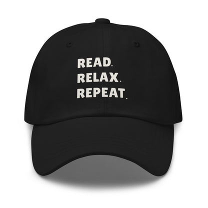 Black cap with 'READ. RELAX. REPEAT.' text on a white background