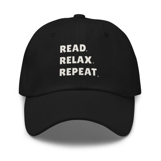 Black cap with 'READ. RELAX. REPEAT.' text on a white background
