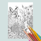 Coloring book page with a fox and rabbit illustration and colored pencils on a light blue background